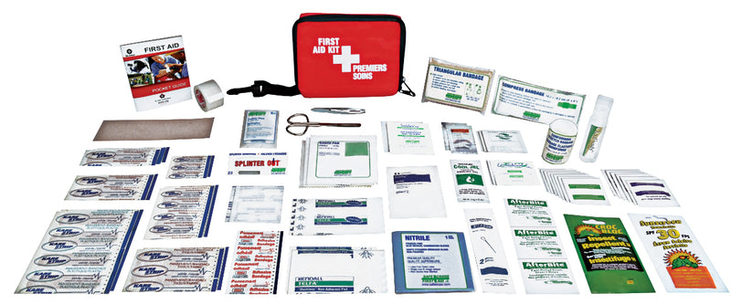 A comprehensive first aid kit displayed out on a white background, including various bandages, antiseptic swabs, and first aid supplies, packaged in a red nylon bag.