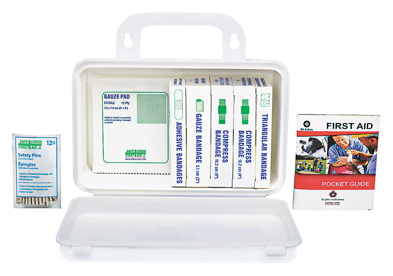 A plastic first aid kit for Ontario WSIB with contents displayed including bandages, gauze, safety pins, and a first aid pocket guide.