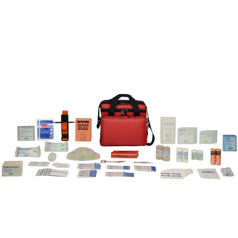 First aid kit contents displayed in front of a red nylon soft pack bag, including various bandages, antiseptic wipes, and medical gloves.