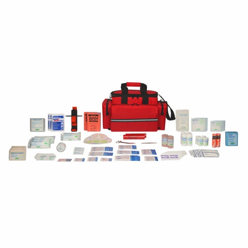 First aid kit with various medical supplies spread out in front of a red nylon soft pack bag.